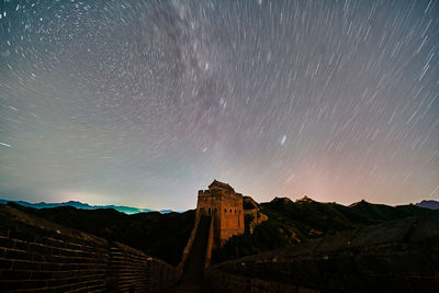 Low angle view of mountain against sky at night