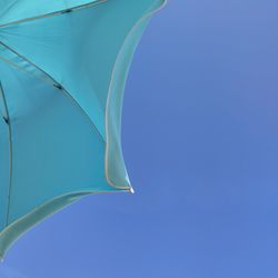 Low angle view of plant against clear blue sky