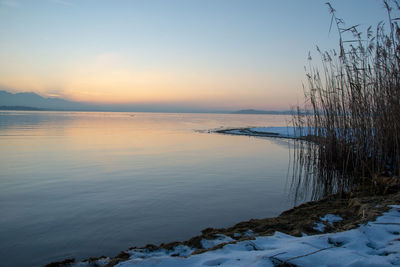 Scenic view of sea against sky during sunset