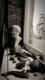 Sculpture of cat on window sill