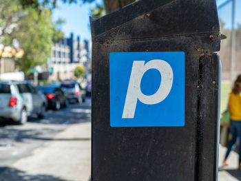 Close-up of road sign on street