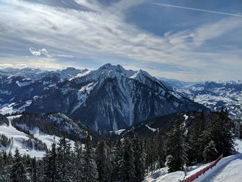 Scenic view of snowcapped mountains against sky