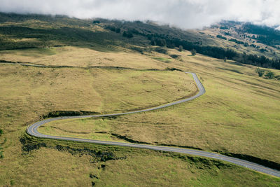 High angle view of road amidst landscape against sky