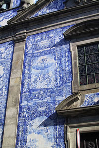 Low angle view of ornate window on building