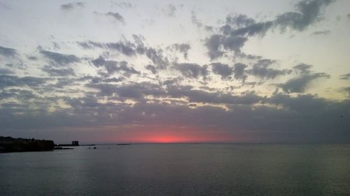 Scenic view of sea at sunset