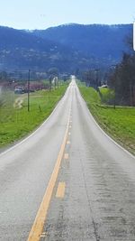 Empty country road along landscape