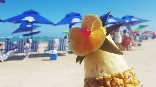 Close-up of ice cream on beach