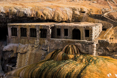 Abandoned building on rocky mountain