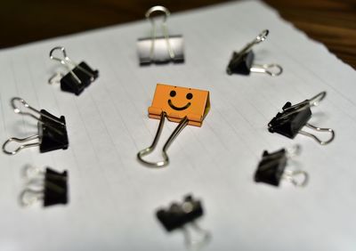 High angle view of binder clips on table