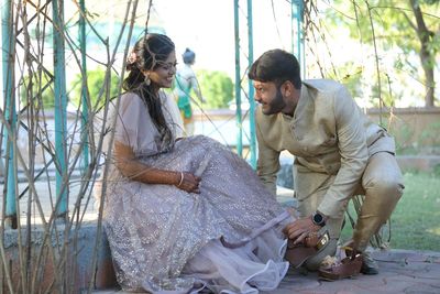 Young couple sitting outdoors