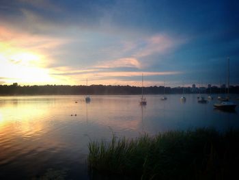 Scenic view of lake at sunset