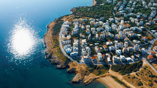 High angle view of sea and buildings in city