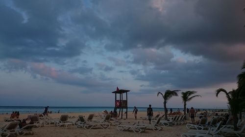 Scenic view of beach against sky during sunset