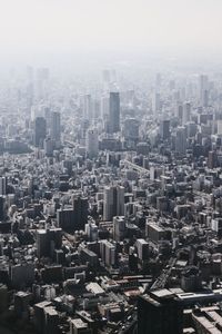 High angle view of modern buildings in city against sky