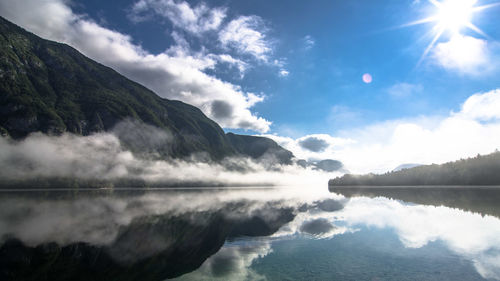 Scenic view of lake against cloudy sky