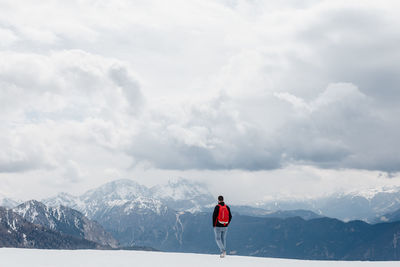 Rear view of woman on snow covered landscape