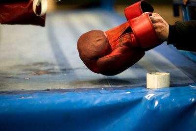 Cropped hand holding boxing glove