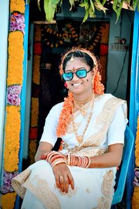 Portrait of young woman wearing sunglasses