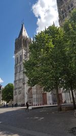 Low angle view of clock tower against sky