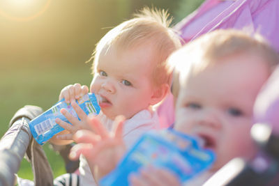 Portrait of cute boy drinking water