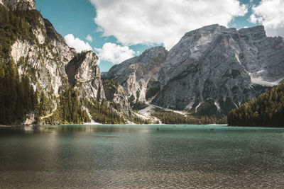 Scenic view of lake and mountains against sky