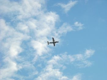 Low angle view of airplane flying in sky