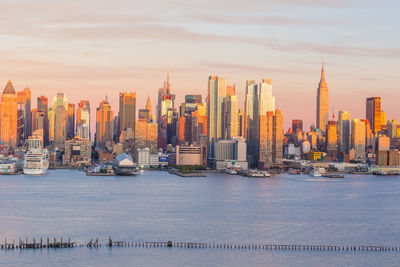 Modern buildings in city at sunset