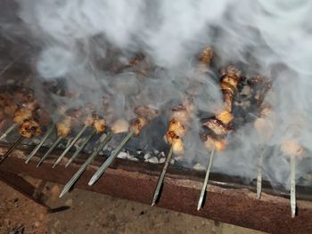 High angle view of bonfire on barbecue grill