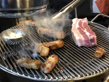 High angle view of meat on barbecue