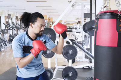 Man boxing in gym