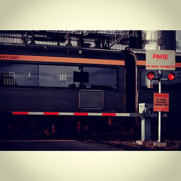 railroad station, text, transportation, public transportation, railroad station platform, rail transportation, western script, communication, illuminated, railroad track, train - vehicle, architecture, information sign, built structure, subway station, public transport, train, travel, passenger train, red