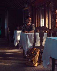  view of man sitting on chair