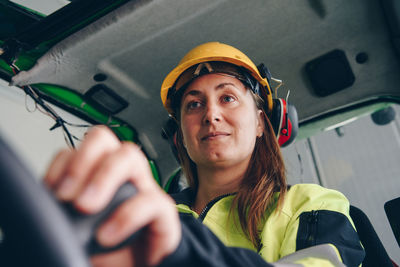 Portrait of young woman in car