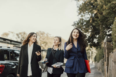 Female coworkers walking together