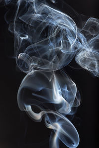 Close-up of smoke against black background