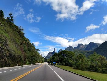 Traveling on the road around nature, under a beautiful blue sky with few clouds. on the horizon. 