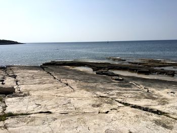 Scenic view of beach against clear sky