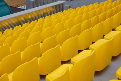 Yellow empty seats at a sports stadium
