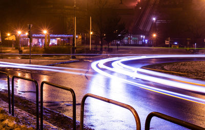 Light trails on street in city at night