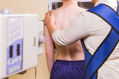 Radiologist treating patient at hospital