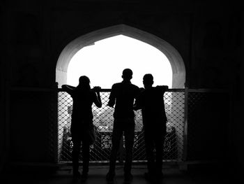 Silhouette of woman in pond