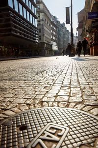 Surface level of footpath against buildings in city