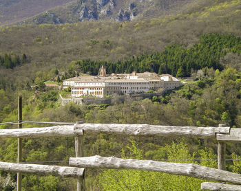 Built structure by trees on mountain