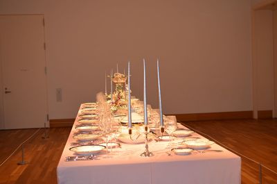 High angle view of dining table with candles