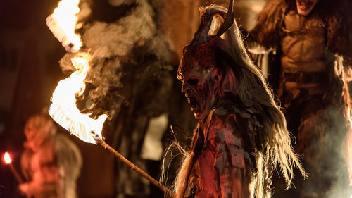 Man with spooky make-up performing at traditional event