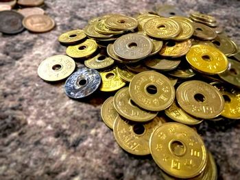 High angle view of coins on table