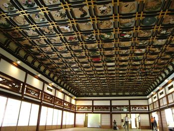 Low angle view of illuminated ceiling