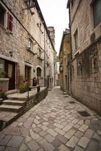 Narrow alley along buildings