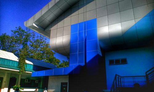 Low angle view of building against blue sky