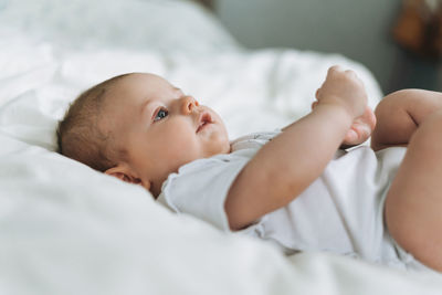 Cute baby lying on bed